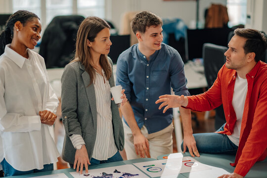 Marketing team analyzing global strategies during office meeting