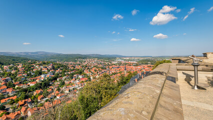 Wernigerode, Germany – August 29, 2024: Looking over the town of Wernigerode and the Harz Mountains from the Wernigerode Castle terrace on a sunny late August morning. It is popular among tourists.