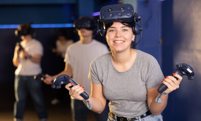 Portrait of a young woman with a very surprised look, who took off her virtual reality glasses