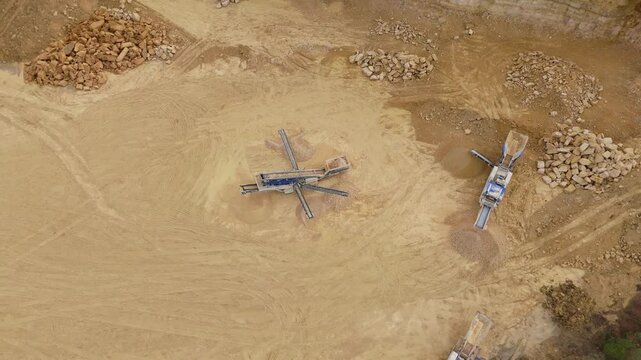 Aerial view drone flyover aggregate extraction mining mineral removal industrial revolution sandstone building industry in England, UK. 