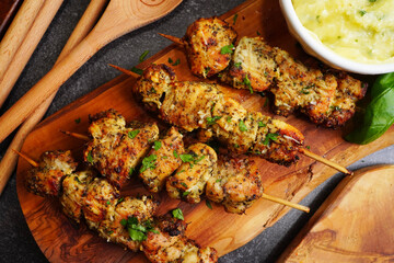 Air Fryer Garlic Parmesan Chicken for dinner. Making chicken for diner with a sauce and or marinade a topped with fresh picked parsley. Using an air fryer.