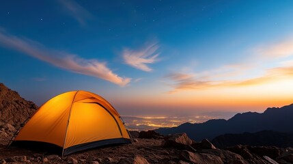 Camp under a starry sky with city lights in the distance at Ras Al Khaimah
