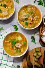 Traditional Russian rassolnik soup with pork and pickles .style rustic