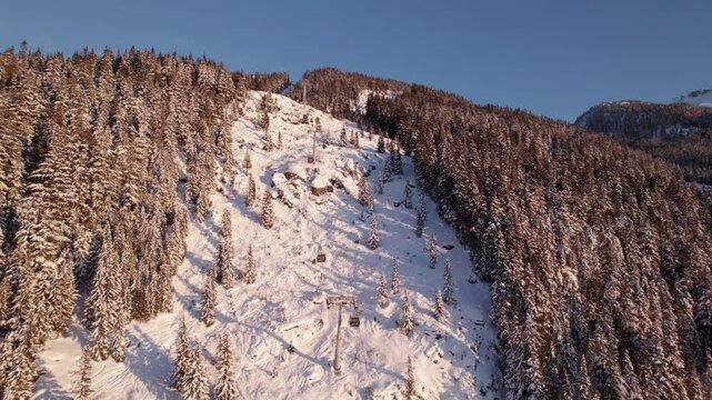 Whistler Mountain Creekside Gondola and ski run with the peak in the background, ski resort, ski lift, winter sport. 4K 24FPS