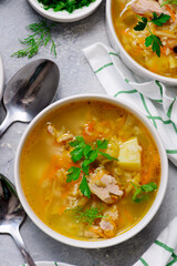 Traditional Russian rassolnik soup with pork and pickles .style rustic