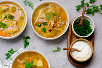 Traditional Russian rassolnik soup with pork and pickles .style rustic