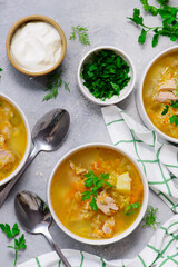 Traditional Russian rassolnik soup with pork and pickles .style rustic