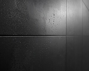 Obraz premium Dark gray textured tiles wall background.