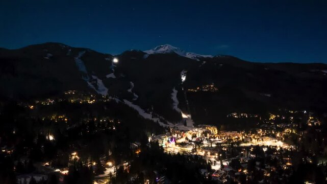 Whistler Mountain aerial hyperlapse at night, snow groomers, city lights, mountain night, ski resort, Whistler Blackcomb. 4K 24FPS PRORES