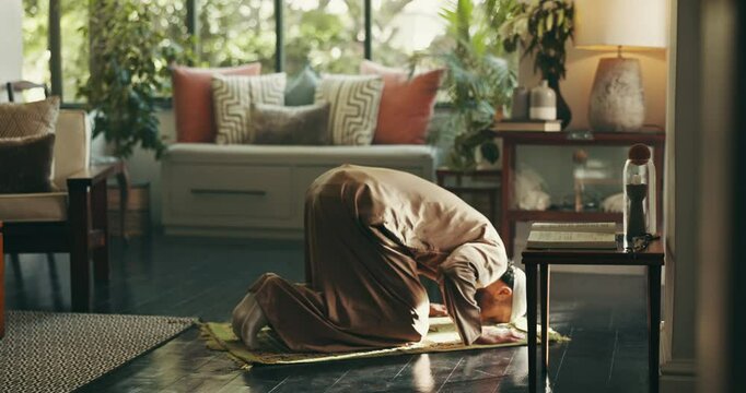 Islamic, religion and man with praying on mat in home for spiritual worship, meditation and muslim faith. Ramadan, person and salah in lounge for fasting tradition, mindfulness and praise to Allah