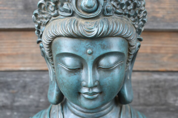 Obraz premium a close-up of the face and head of an ancient chinese bronze statue,