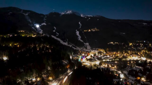 Whistler Mountain aerial hyperlapse at night, snow groomers, city lights, mountain night, ski resort, Whistler Blackcomb. 4K 24FPS PRORES