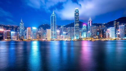 Obraz premium Vibrant Night Skyline of Hong Kong with Brilliant Colors Reflection