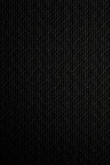 Black suede with fine grain, uneven texture, muted light, style, graphic