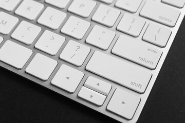 Technical support concept. Modern keyboard on black background, closeup