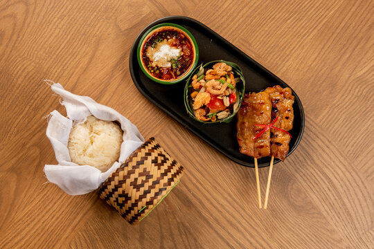 Indoor food photography thai skewers & sticky rice delight