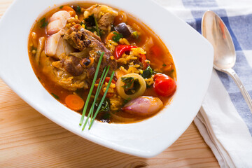 Image of soup of lamb with rice, vegetables, garlic and onion, served in bowl
