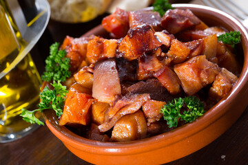 Spanish dish - roasted pig nose and cheeks. High quality photo