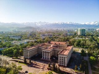 Obraz premium View of the city of Almaty from above. aerial photography of the city landscape. An ancient building in the city center, which houses the Kazakh-British University.