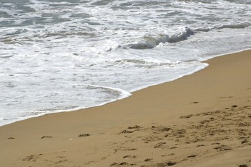 edge of ocean tidal waves on sandy beach