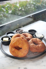 Delicious pastries served with a variety of toppings at a cafe