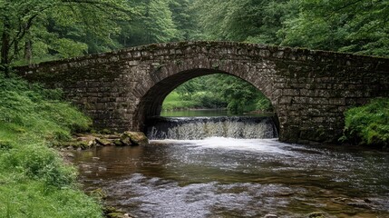 Fototapeta premium Tranquil Stone Arch Bridge Over Serene River Surrounded by Nature