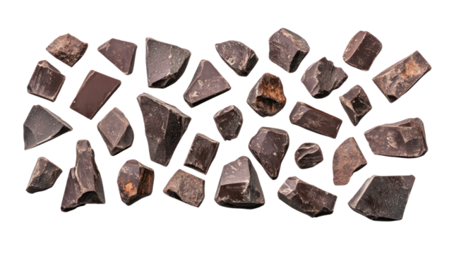 Various dark stone fragments arranged creatively on a white background.