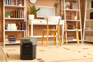 Portable power station on carpet in office