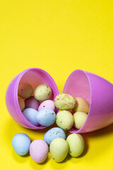 colourful chocolate easter eggs with candy shell against white.