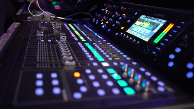 Black audio mixer with screen and buttons