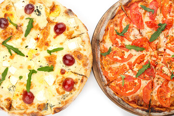 Wooden boards with different delicious pizzas on white background