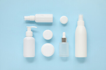 Different cosmetic products on blue  background