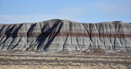 Mountains in Arizona's Painted Desert with colorful geologic bands. 