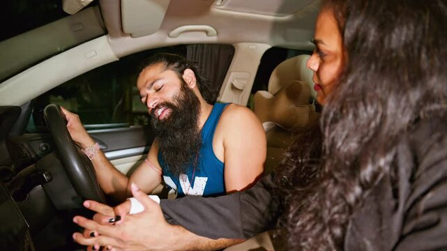 Husband wife joyfully talk sitting in the car outside