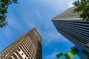 Dramatic Perspective of Modern Skyscrapers Against a Blue Sky