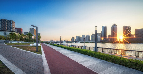 Sunset Illumination on Modern Cityscape and Waterfront