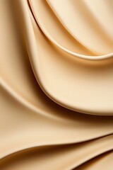 The image showcases elegant folds of soft, beige fabric, highlighting rich textures and smooth surfaces that evoke a sense of luxury.