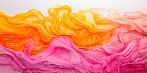 Fototapeta premium Vibrant, flowing fabric in shades of yellow, orange, and pink, creating a soft, textured wave effect against a light background.