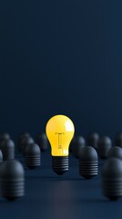 glowing yellow light bulb stands out among unlit black bulbs, symbolizing creativity and innovation