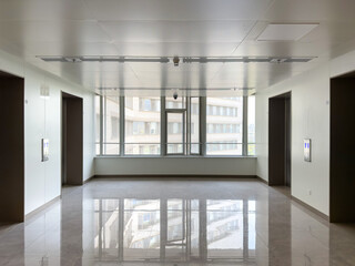 Bright Modern Office Hallway with Windows and Elevators