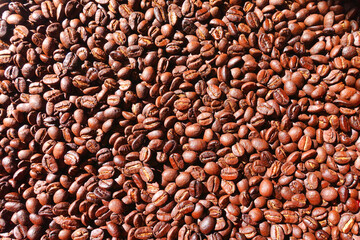 Top view background of brown coffee beans