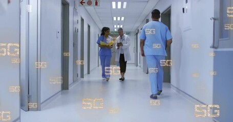 Walking in hospital corridor, healthcare professionals with 5G technology animation overlay - Powered by Adobe