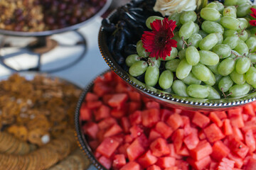 Fruit platters on a snack table.