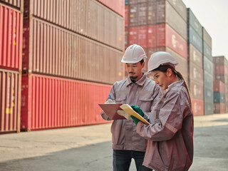 A team of engineers talks to managers at the Container cargo .