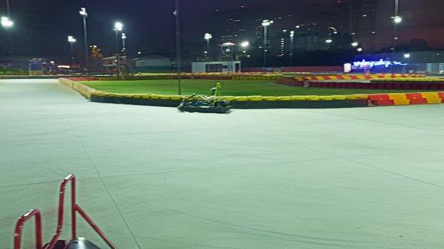 Go kart is speeding along bright lane borders