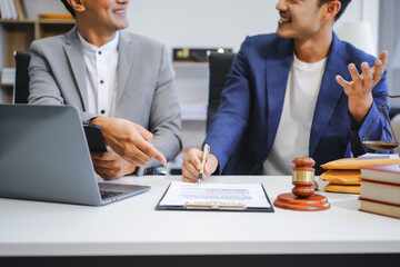 A businessman and a male lawyer or a team of judges discuss a joint investment meeting. They...