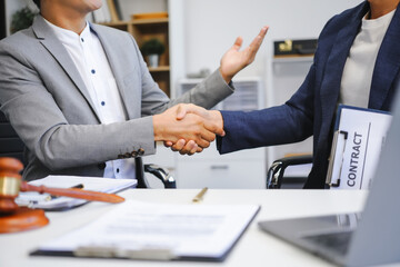 A businessman and a male lawyer or a team of judges discuss a joint investment meeting. They...