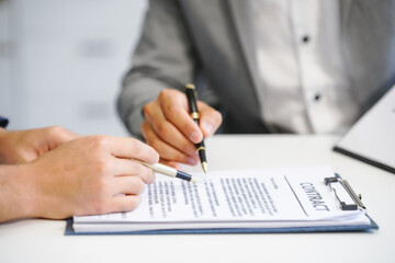 Fototapeta premium A businessman and a male lawyer or a team of judges discuss a joint investment meeting. They provide legal advice, review contracts, and ensure compliance with business laws and regulations