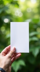 Close-Up of Hand Holding Blank Brochure for Design Presentation &ndash; Generative AI