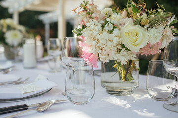 Wedding celebration reception floral centerpiece on table.